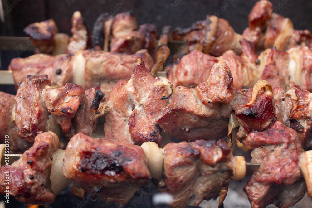 Background of pieces of meat, barbecue fried on a fire. Background of pieces of meat, barbecue fried on a fire.