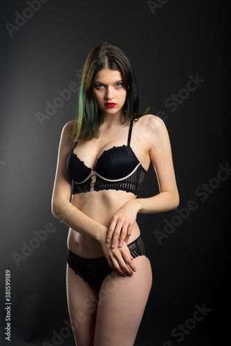 Vertical view photo beautiful shy lady in lace bikini boudoir bra panties. Tender skinny slim shape. © Ivan Zelenin