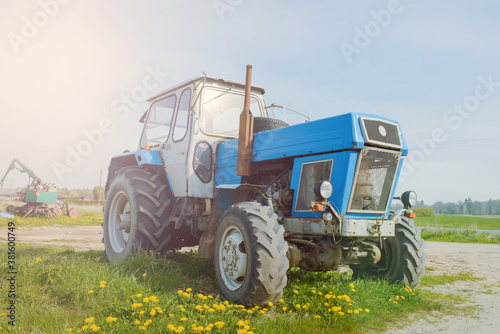 Old farm tractor rusted and broken