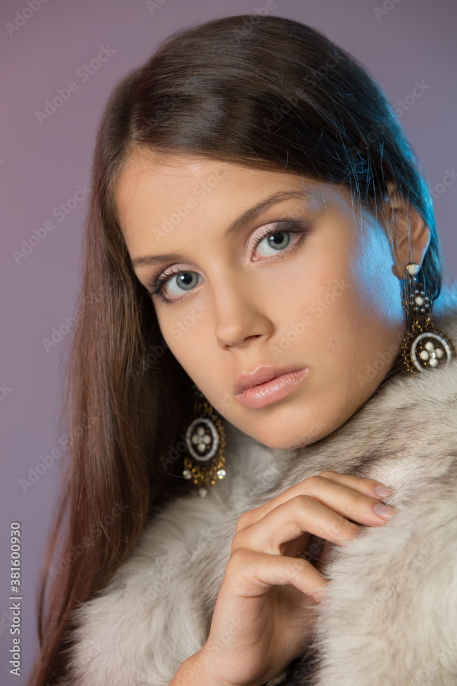 Beautiful teenager girl in studio on gray background Beautiful teenager girl in studio on gray background