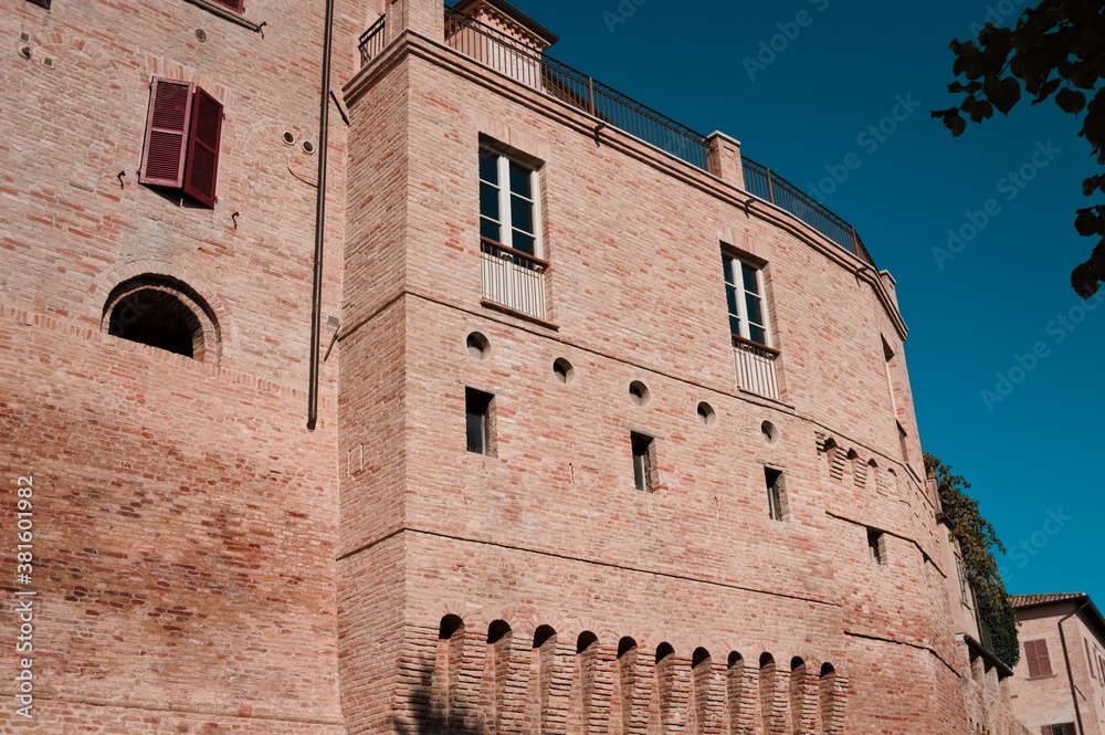Facade of an old medieval building with windows and a terrace (Corinaldo, Marche, Italy, Europe)
