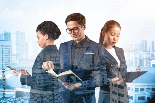 Photography Group of three business colleagues in suits working on project together to gain new career opportunities