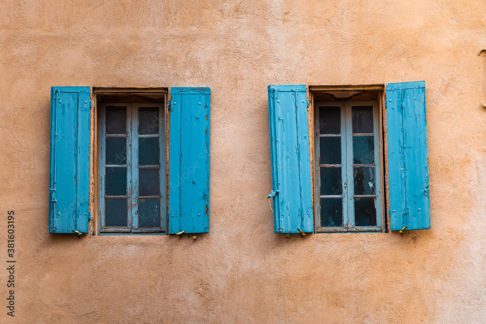 Two wooden windows of an old town