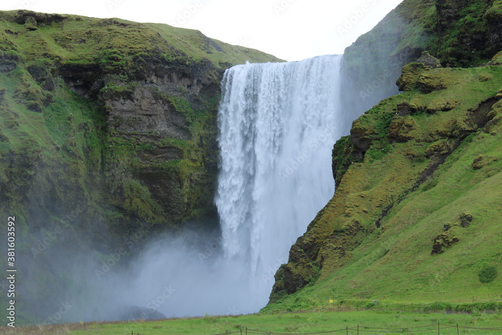 Fototapeta premium Skogafoss Waterfall in South Iceland on a misty summer day