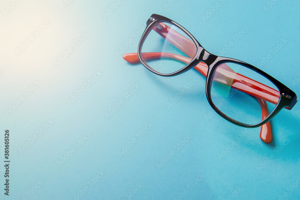 pair of red plastic-rimmed eyeglasses pair of red plastic-rimmed eyeglasses