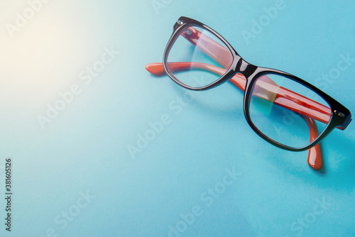pair of red plastic-rimmed eyeglasses