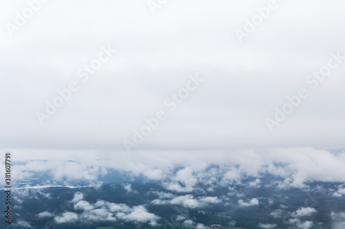 Fog and clouds over landscape from Veslehødn Veslehorn, Hemsedal Norway. photo