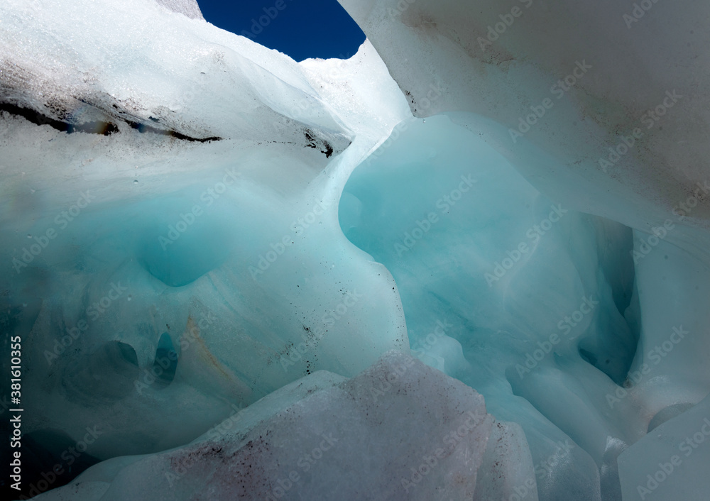 Blue ice inside a mountain glacier grotto. Alibek, Dombay August 2020.