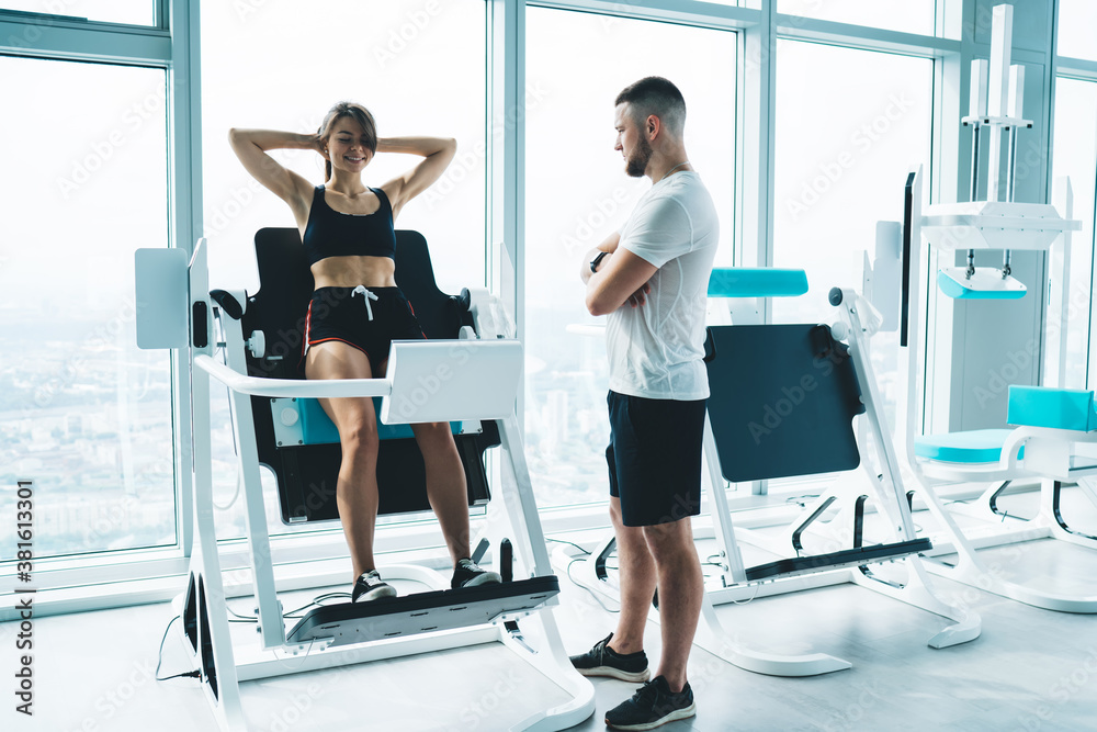 Fototapeta premium Powerful sportswoman doing abs exercise