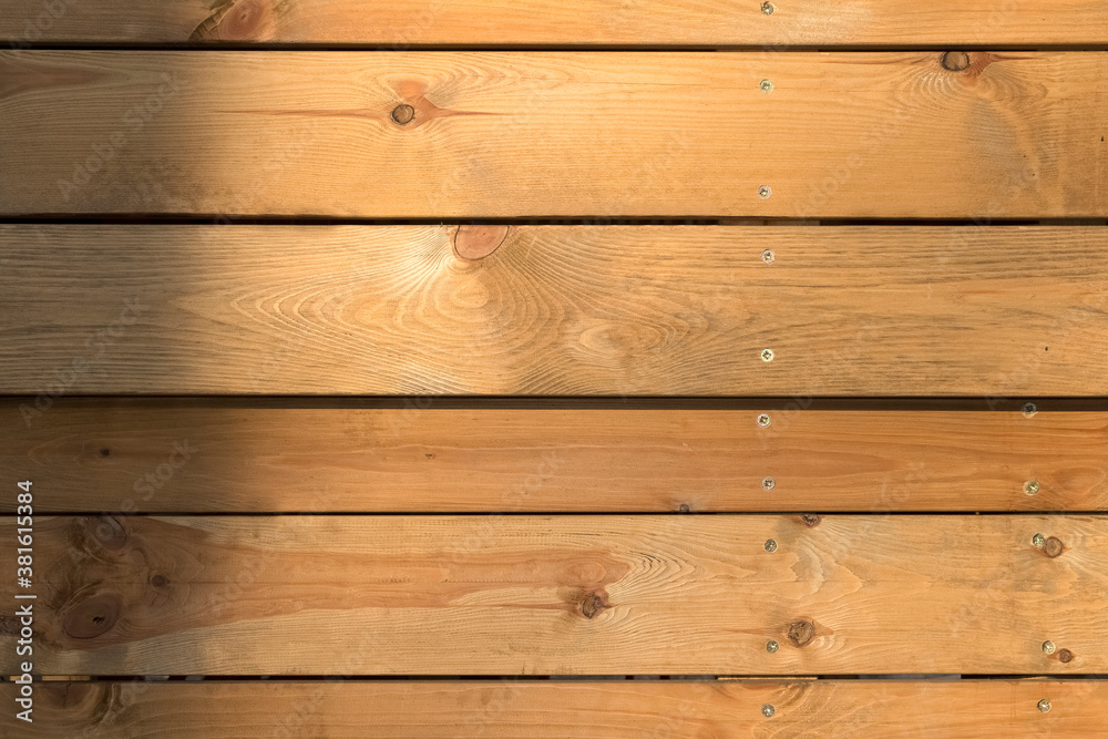 Fototapeta premium The background cladding is made of light wood planks.