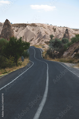 Car travel concept - a road with asphalt among the mountains. Summer trip to Cappadocia, Turkey © svitlini