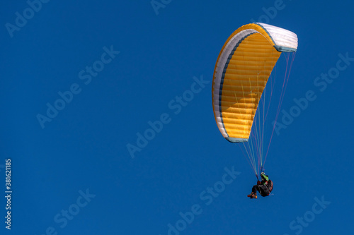 paragliding hang glider in the blue sky