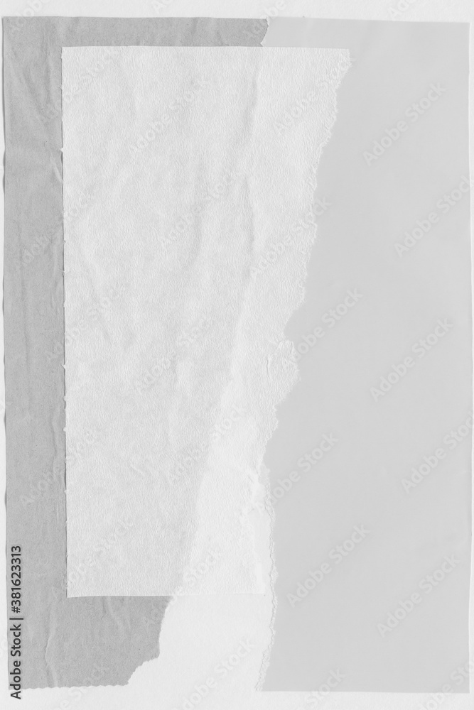 White torn paper collage close-up. Texture made from various paper and cardboard parts. Damaged old paper background. Vintage blank wallpaper. Material design backdrop. White torn paper collage close-up. Texture made from various paper and cardboard parts. Damaged old paper background. Vintage blank wallpaper. Material design backdrop.