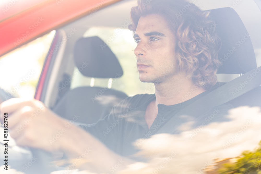 Young caucassian man driving to work anad start a new day Young caucassian man driving to work anad start a new day