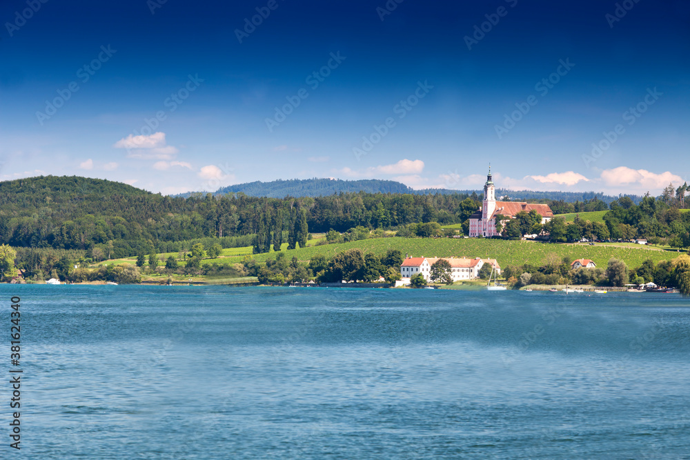 Fototapeta premium View over Lake Constance, ,near Uhldingen on the horizon the Pilgrimage church Birnau , Lake Constance, Baden-Württemberg, Germany, Europe