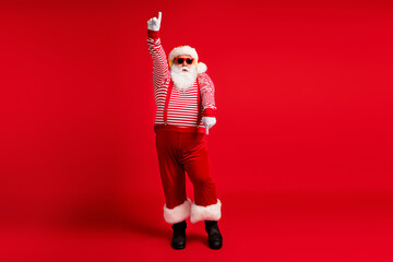 Full length body size view of his he handsome bearded fat overweight cool comic childish Santa listening hit dancing having fun fooling isolated bright vivid shine vibrant red color background