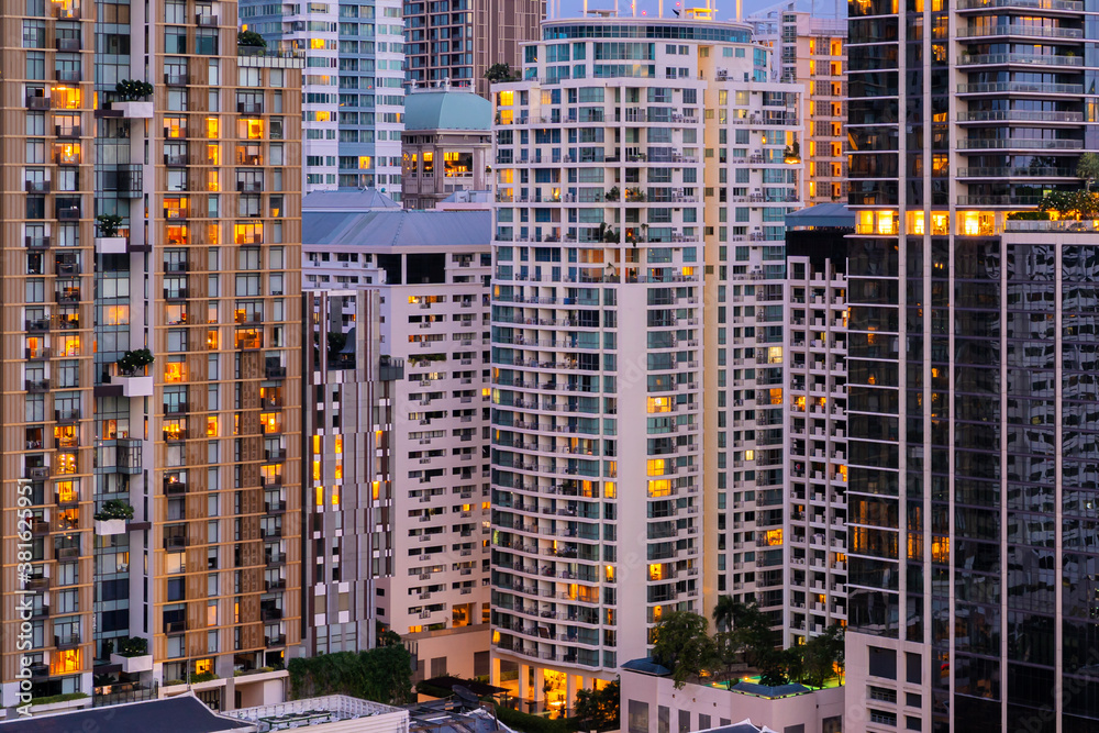 Aerial view of Bangkok modern office buildings, condominium in Bangkok city downtown with sunset sky , Bangkok , Thailand