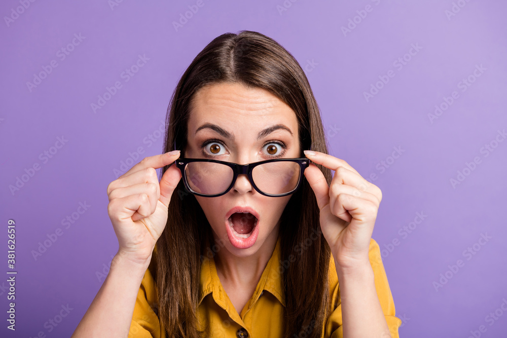 Photo of young pretty lady hold glasses mad open mouth staring wear specs yellow shirt isolated violet color background