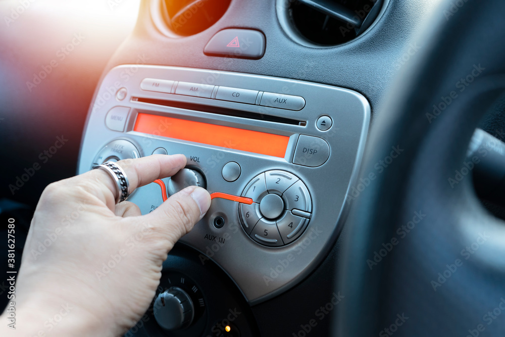 Car audio system concept. Music player in car. Stock Photo | Adobe Stock