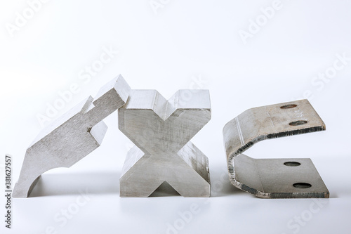 Sheet metal bending tool and equipment isolated on a white background. Bend tools, press brake punch and die. photo