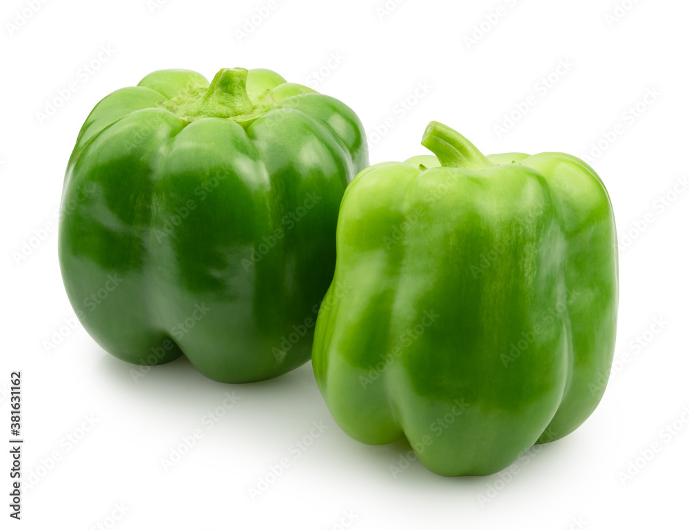 two green bell peppers isolated on white two green bell peppers isolated on white