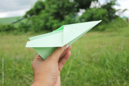 Green paper aeroplane - Green travel concept