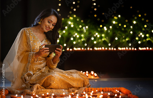 Woman clicking a picture of the decoration  on her phone	