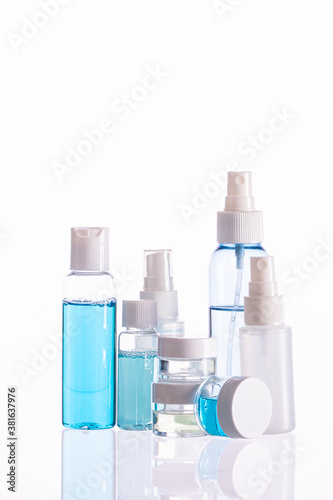 Set of organic cosmetic daily skincare cleansing products, different bottles, jars with liquids isolated on white background. Skin care routine steps trends, dermatology, beauty, treatment concept