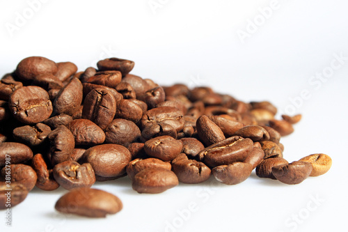 Coffee beans in close up on the white background isolated.
