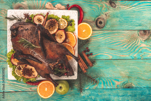Homemade Roasted Duck with Herbs on rustic wooden table for the Holidays, banner, catering menu recipe place for text, top view