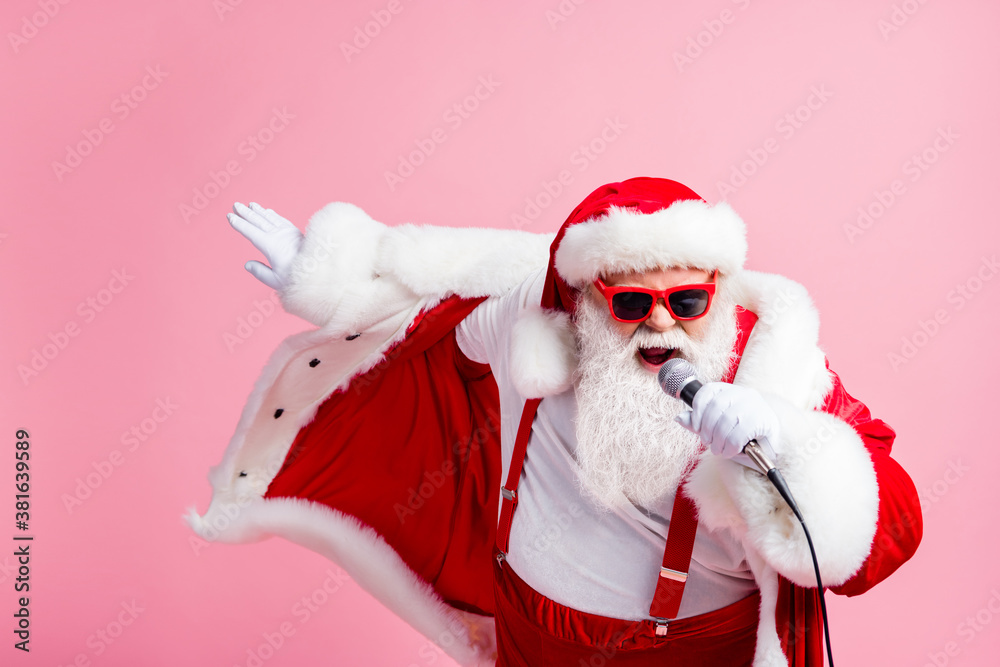 North-pole x-mas christmas celebrity grey beard santa claus sing microphone  song have newyear live concert wear headwear cap suspenders sunglass  isolated over pastel color background Stock Photo | Adobe Stock