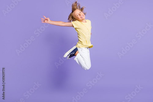 Full body photo of carefree boy jump up wear casual style clothes isolated over violet color background © deagreez