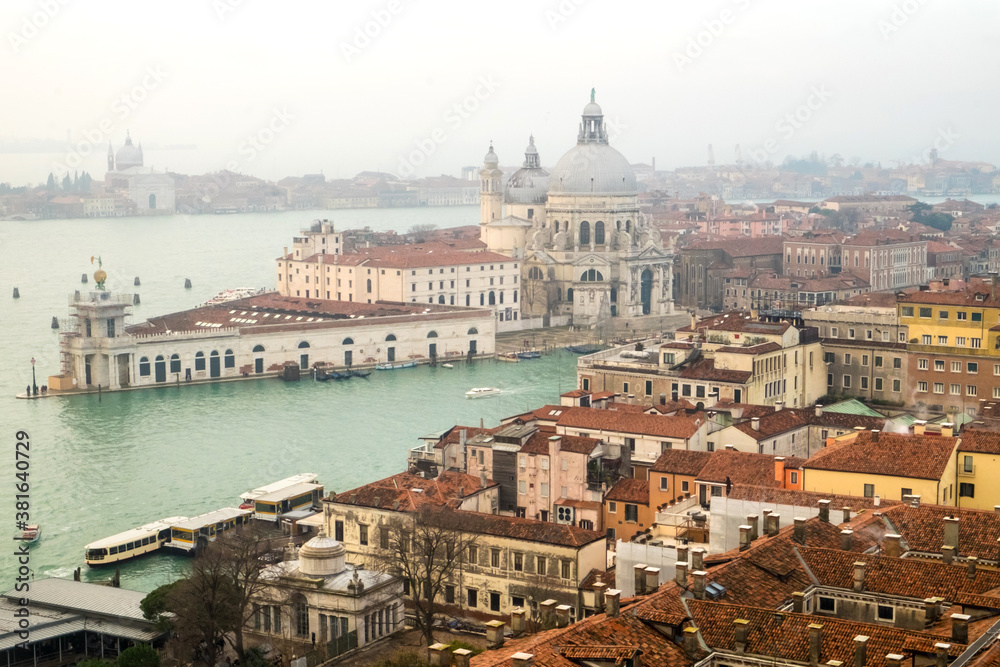 Panorama with the red roofs, Adriatic sea and the most impressive historical buildings of the old romantic Venice, Italy