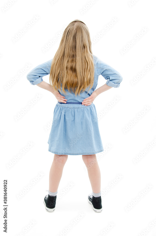 Back view of little girl looking at wall. Rear view. Isolated on white background
Back view of little girl looking at wall. Rear view. Isolated on white background