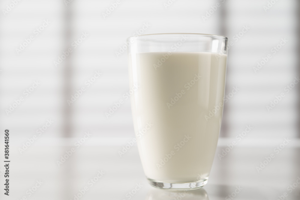 Glass of milk on the kitchen table Glass of milk on the kitchen table