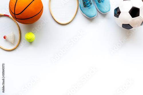 Sport games background - basketball  soccer ball  rackets  sneakers - copy space