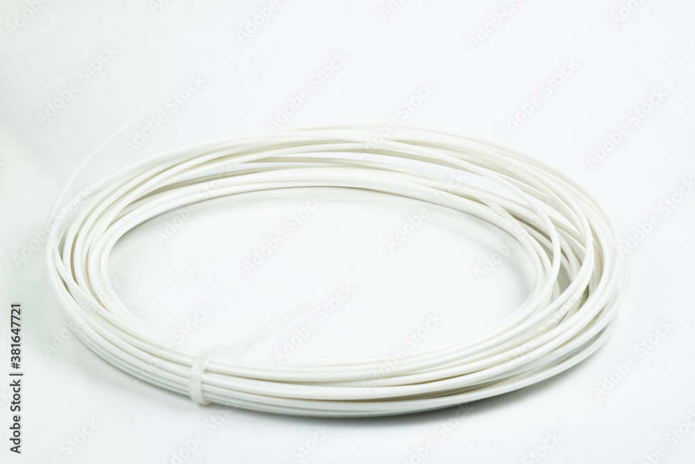 Top view of white rolled filament plastic for 3D Printing Pen isolated on white. Top view of white rolled filament plastic for 3D Printing Pen isolated on white.