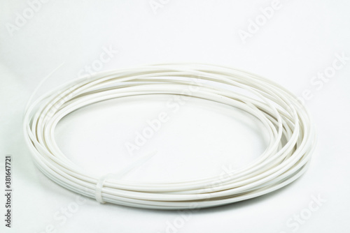 Top view of white rolled filament plastic for 3D Printing Pen isolated on white.