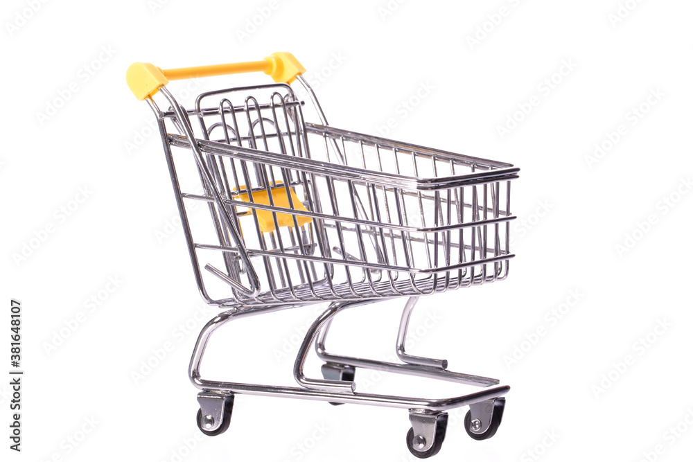 Small metal empty shopping cart trolley isolated on white background. Department store, supermarket, e-commerce, online shopping, marketing deal poster, black friday sale concept. Copy text space Small metal empty shopping cart trolley isolated on white background. Department store, supermarket, e-commerce, online shopping, marketing deal poster, black friday sale concept. Copy text space