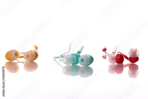 Colorful earphones isolated on white background. Playlist, podcast, entertainment gadget, relax, meditation, digital, listening music accesories, joy, leisure, resting, music store concept. Copy space