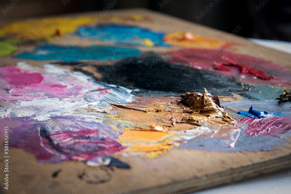 Artist's color palette. Dried oil paint. Creativity and art Artist's color palette. Dried oil paint. Creativity and art