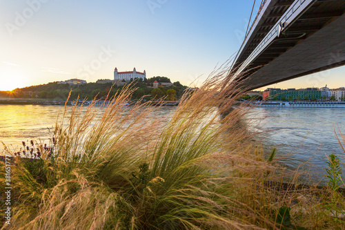 Photography Bratislava castle over Danube river and Bratislava old town, Slovakia