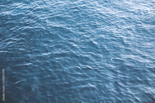  Closeup of calm surface of river water with water in blue.