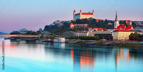 Bratislava castle over Danube river and Bratislava old town, Slovakia photo