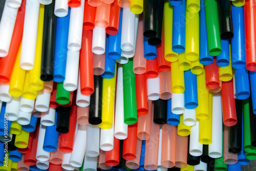 close-up on multi coloured plastic drinking straws . selective focus