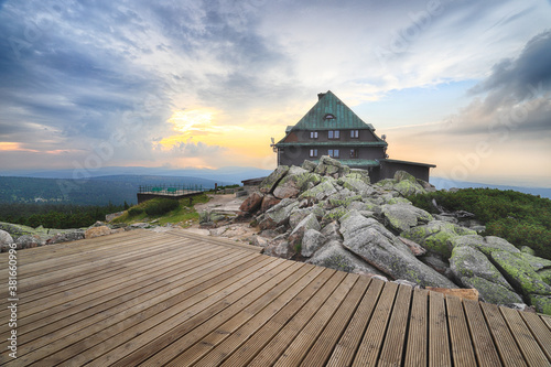 Szrenica mountain shelter (1362 m above sea level) during sunset, Szklarska Poreba, Poland, Europe. photo