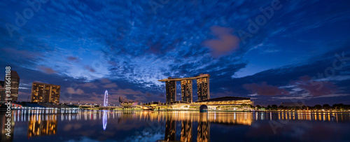 Wide panorama image of Singapore skyscrapers early in the morning.
