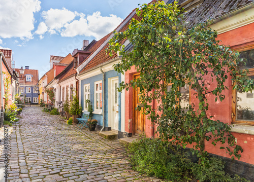Fototapeta Naklejka Na Ścianę i Meble -  Idylic cobbled street at the old town of Aalborg, Denmark