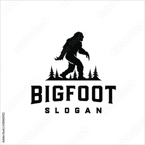 Bigfoot walks between pine trees photo