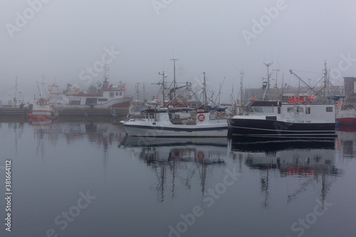 Fog in port of the polar town Vardo of the coast of the Barents sea, Varanger national scenic route in Finnmark, Norway © Arkadii Shandarov